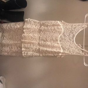 Mid-thigh length cream laced dress.